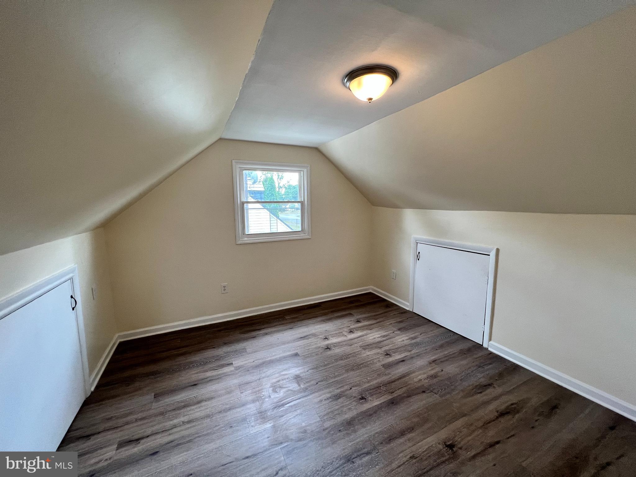 1008 Terrace Boulevard Trenton, NJ 08618 - Photo 15 of 18 an empty room with wooden floor and windows
