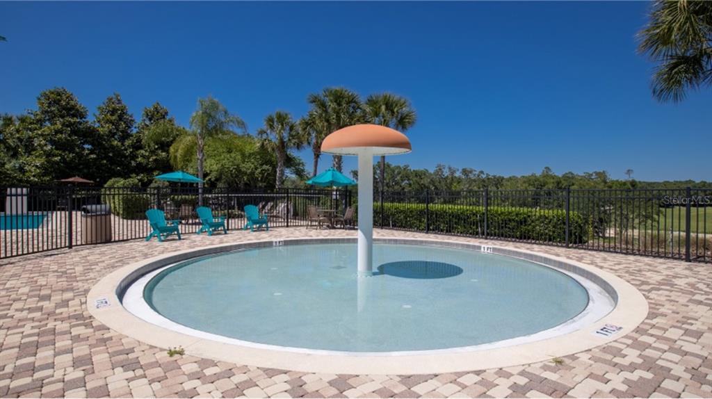 5513 Morant Bay Path Kissimmee, FL 34758 - Photo 26 of 32 a view of a swimming pool with a yard