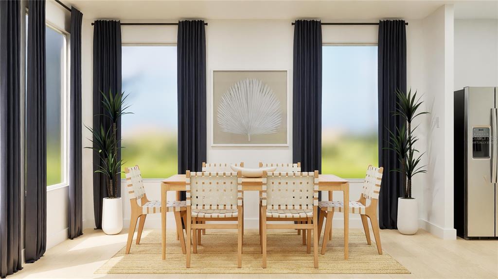 5513 Morant Bay Path Kissimmee, FL 34758 - Photo 4 of 32 a dining room with furniture and a floor to ceiling window