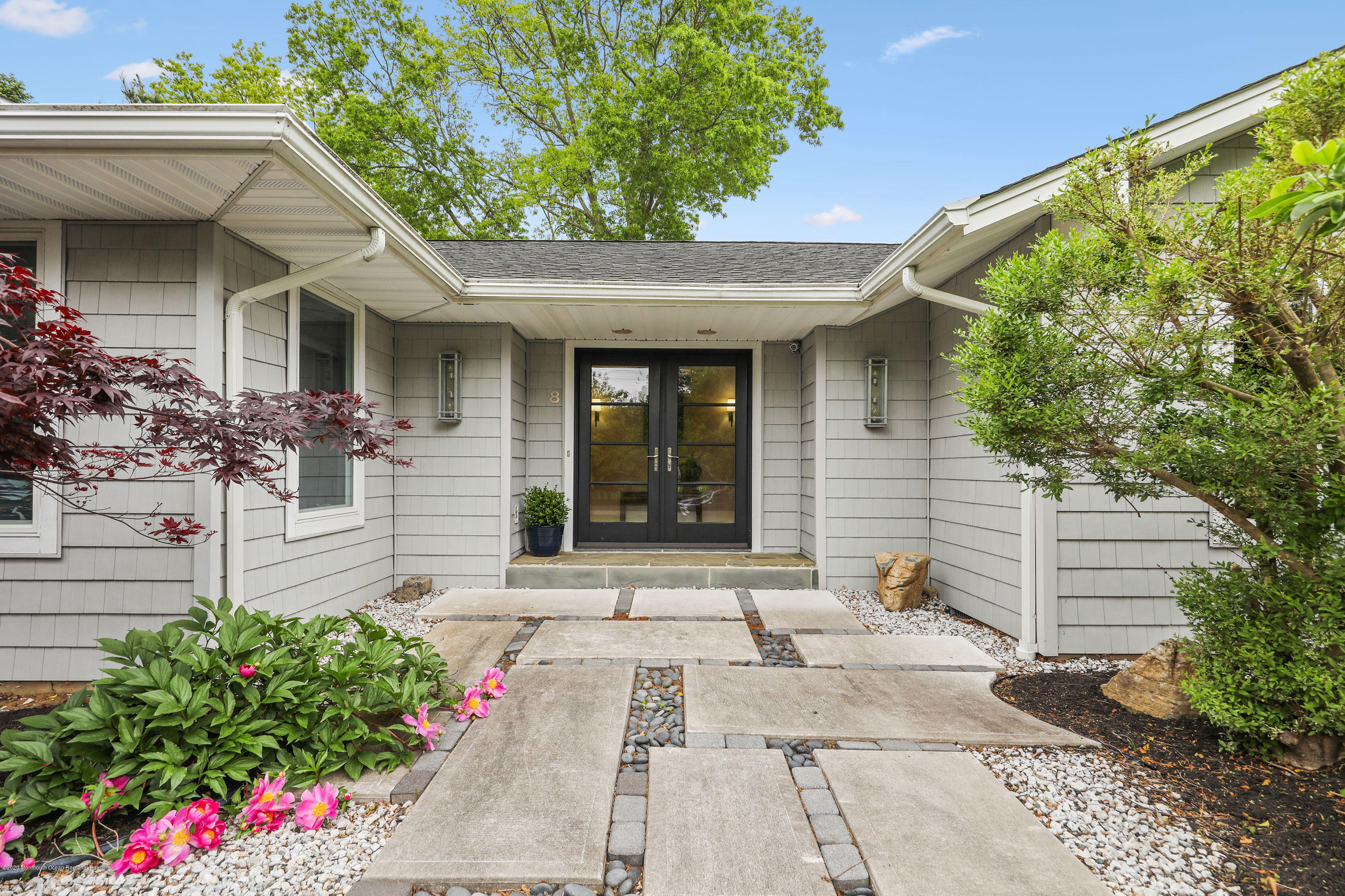 8 Riverside Drive Rumson, NJ 07760 - Photo 2 of 29 a front view of a house with a yard