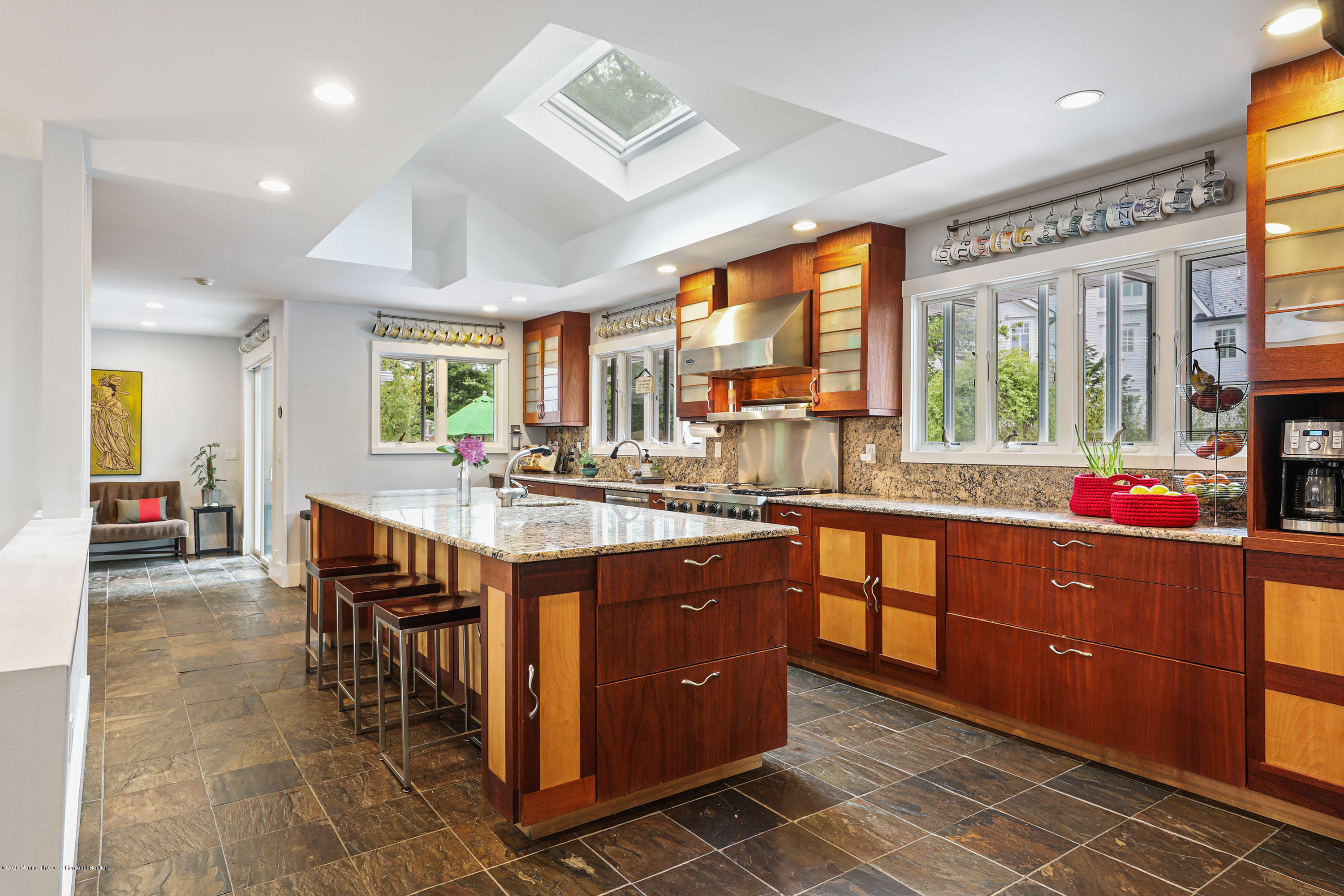 8 Riverside Drive Rumson, NJ 07760 - Photo 8 of 29 a kitchen with stainless steel appliances granite countertop sink window and chairs