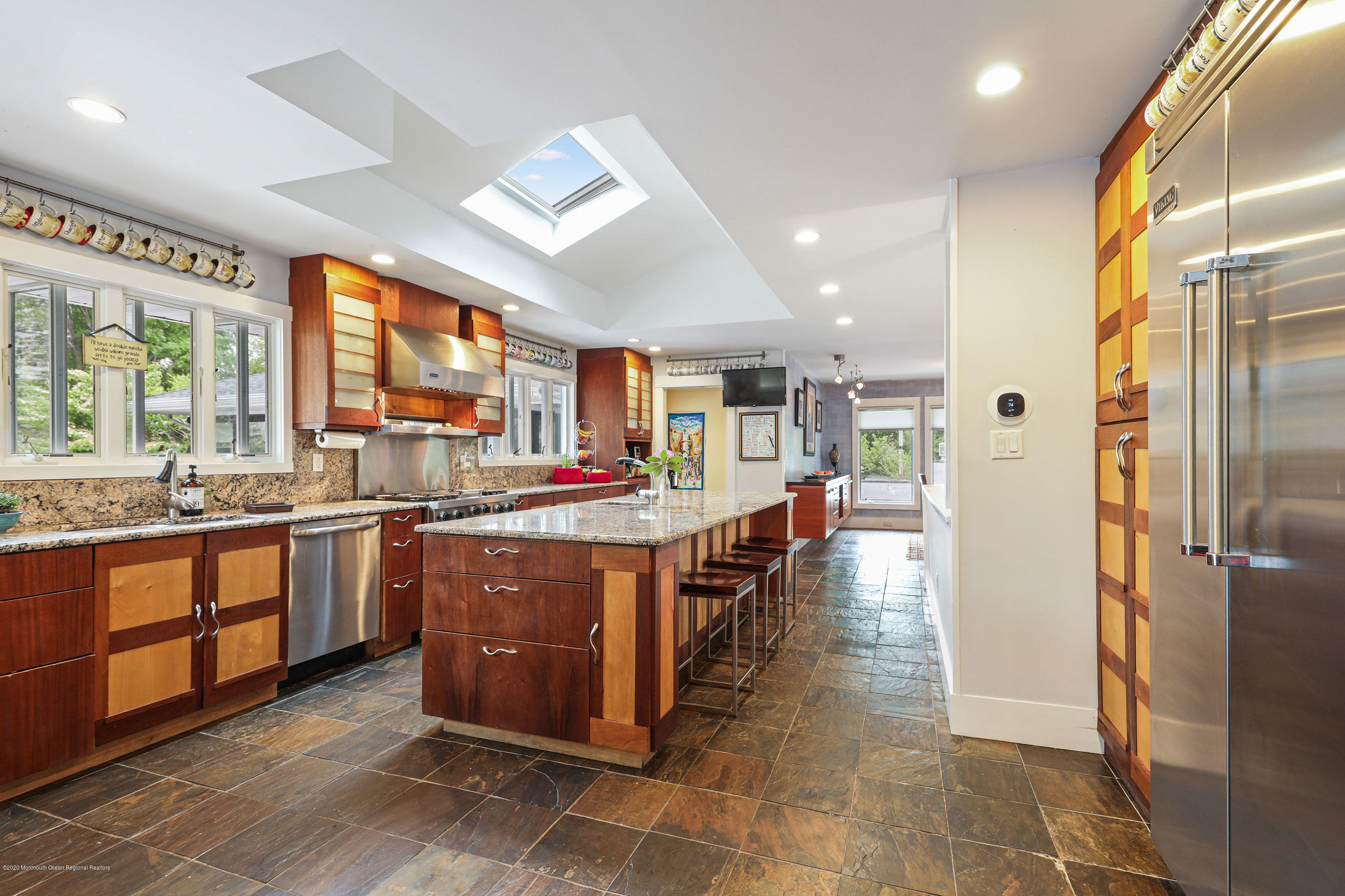8 Riverside Drive Rumson, NJ 07760 - Photo 9 of 29 a large kitchen with stainless steel appliances granite countertop a large counter top and a stove