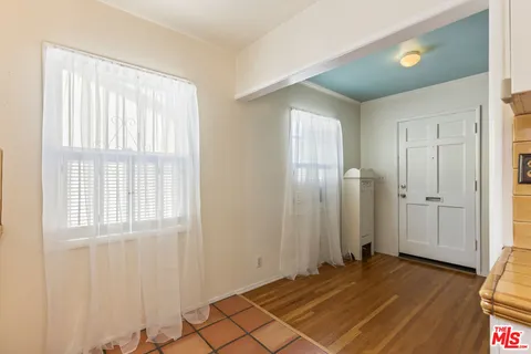 a stove top oven sitting inside of a kitchen