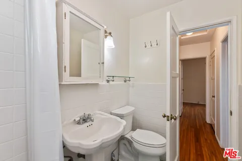 a view of a house with backyard and a tree