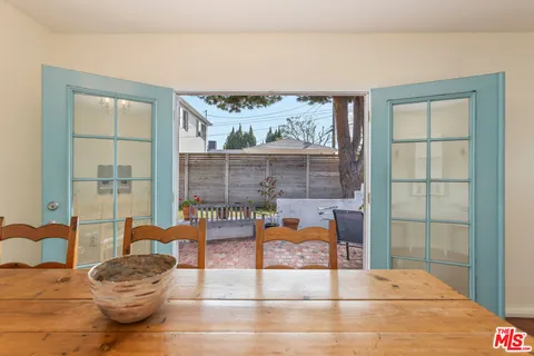 a dining room with furniture and chandelier