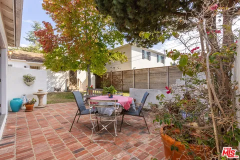 a view of a wooden fence next to a road