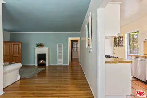 a kitchen with granite countertop cabinets a sink and a stove