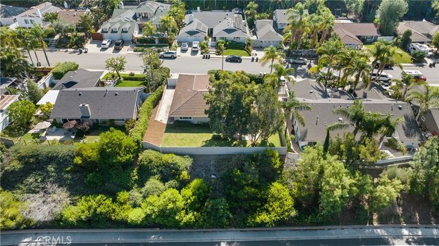 an aerial view of house with yard swimming pool and outdoor seating