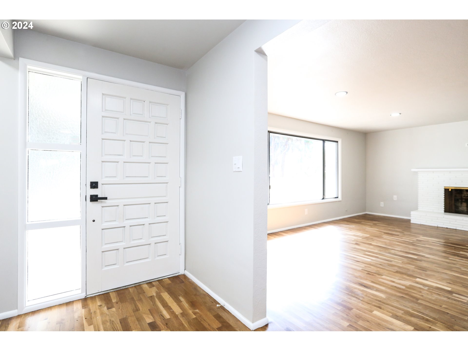 805 Kelly Lane Eugene, OR 97404 - Photo 2 of 31 a view of an empty room with wooden floor