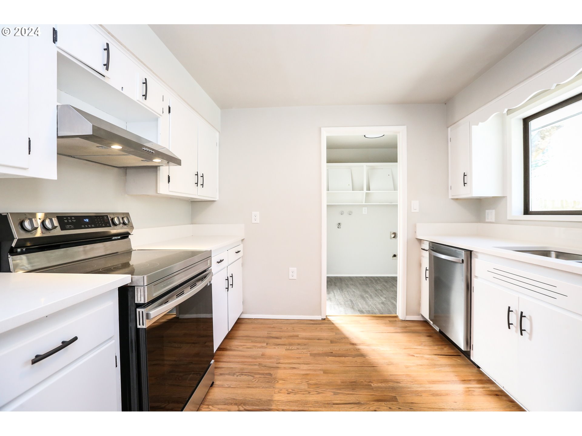 805 Kelly Lane Eugene, OR 97404 - Photo 5 of 31 a kitchen with granite countertop a stove and a sink