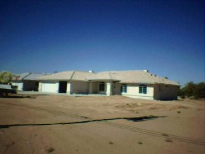 14752 Ranchero Street Hesperia, CA 92345 - Photo 1 of 1 a front view of a house with large trees
