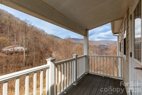 a view of a balcony with furniture
