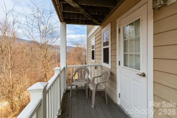 a view of balcony with furniture