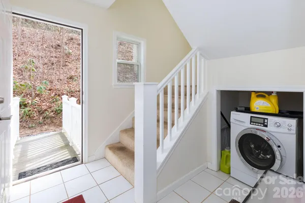a view of livingroom with washer and dryer