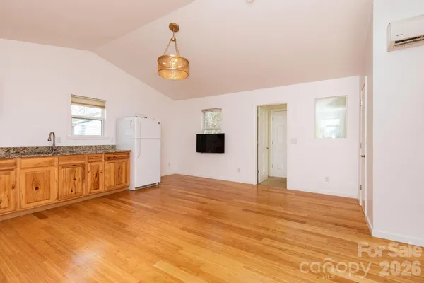a view of a kitchen with a sink and cabinet area