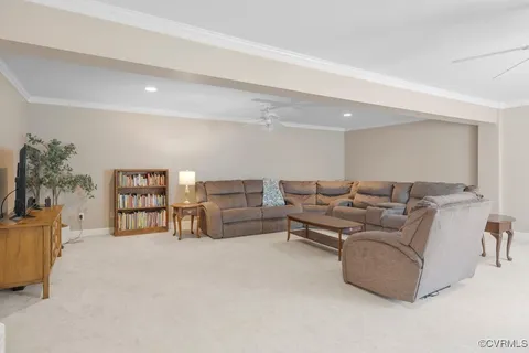 a living room with furniture and white walls