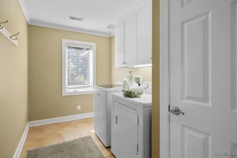 a room that has a window and a dresser in it