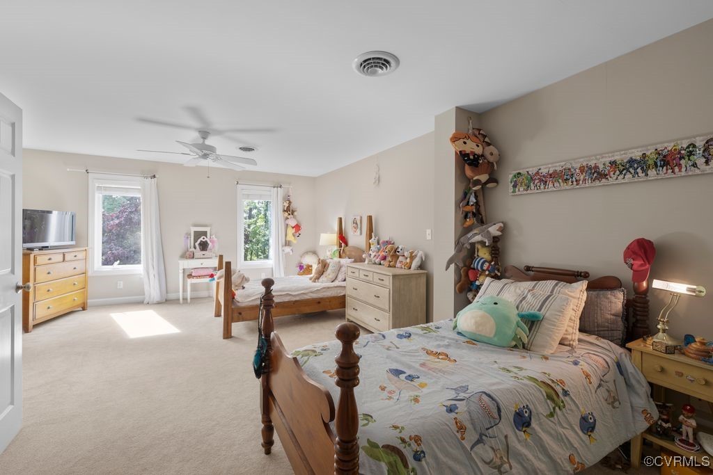 532 Fords Road Manakin-Sabot, VA 23103 - Photo 25 of 46 a bed room with a bed and a chandelier