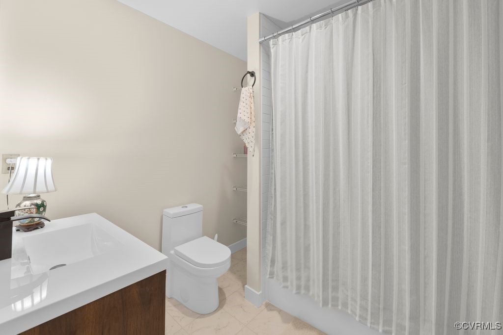 532 Fords Road Manakin-Sabot, VA 23103 - Photo 29 of 46 a white toilet sitting next to a bathroom sink