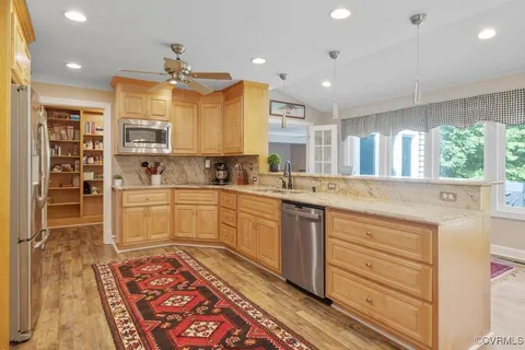 a large bathroom with a large mirror vanity and sink