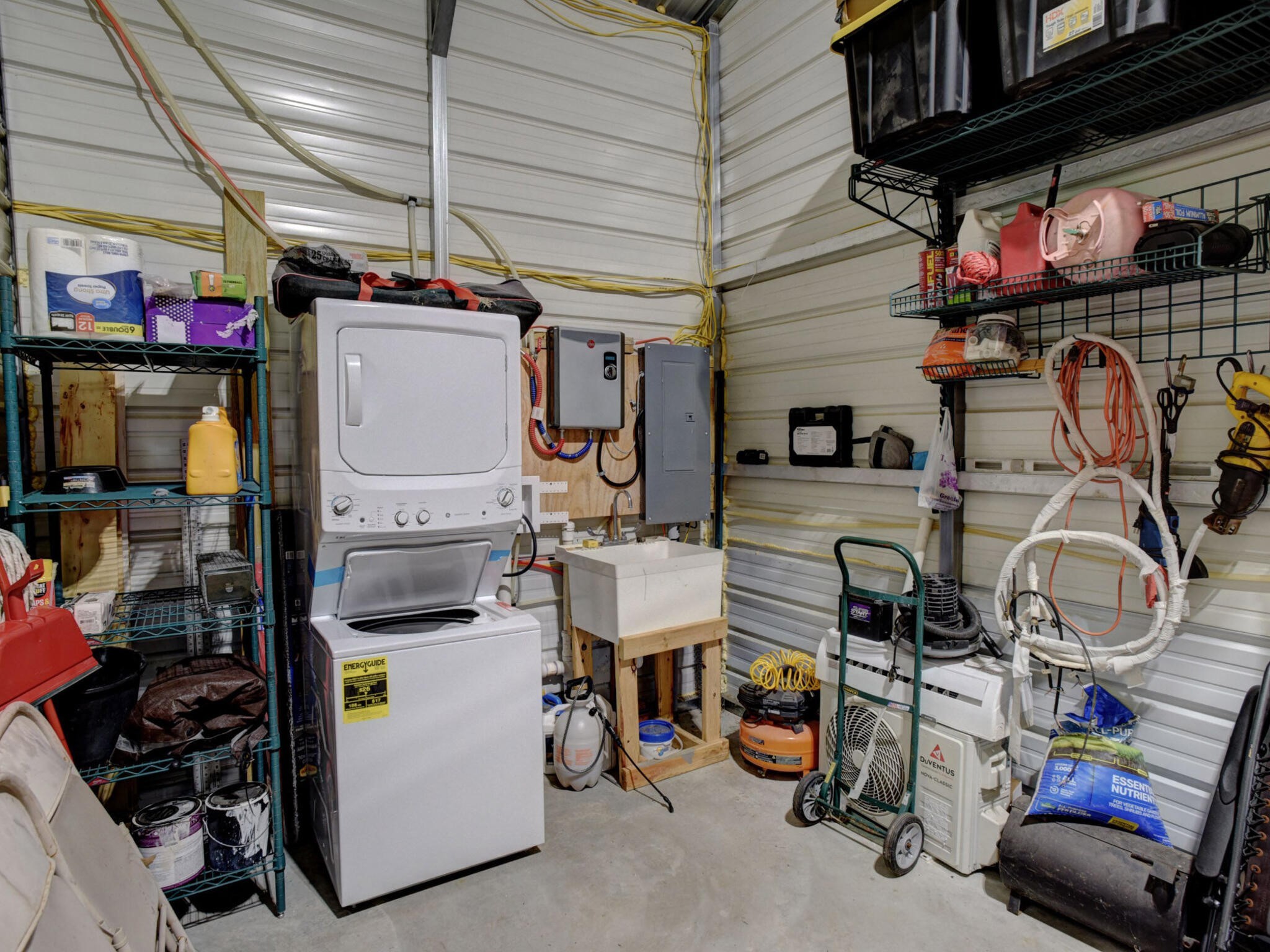 3747 Sparta Field Road Flatonia, TX 78941 - Photo 14 of 37 a utility room with lot of items