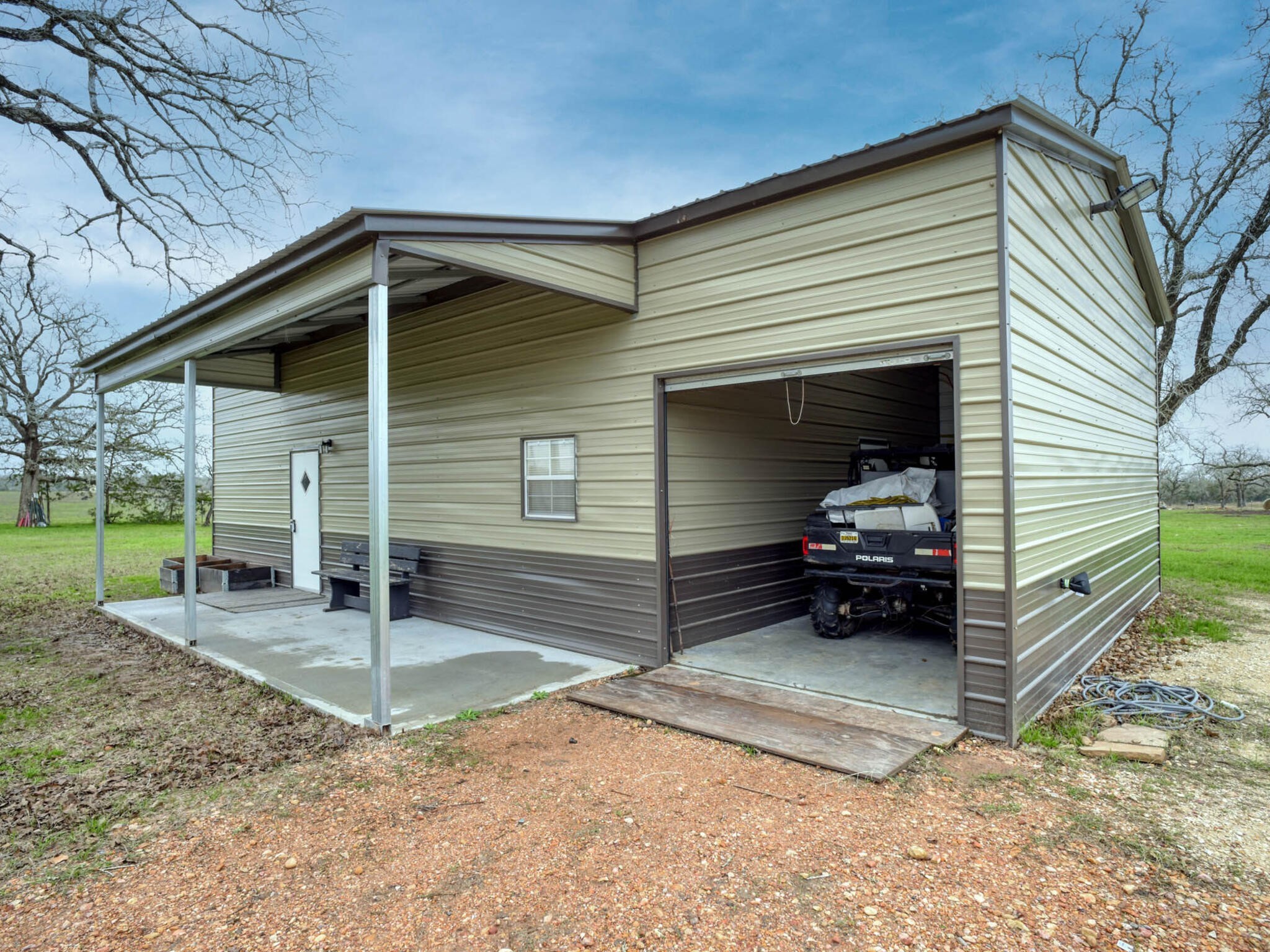 3747 Sparta Field Road Flatonia, TX 78941 - Photo 16 of 37 a view of a car garage with a yard