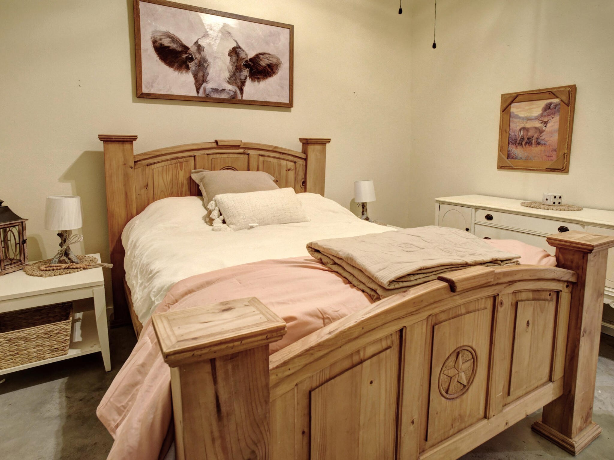 3747 Sparta Field Road Flatonia, TX 78941 - Photo 25 of 37 a bedroom with a bed and a painting on the wall