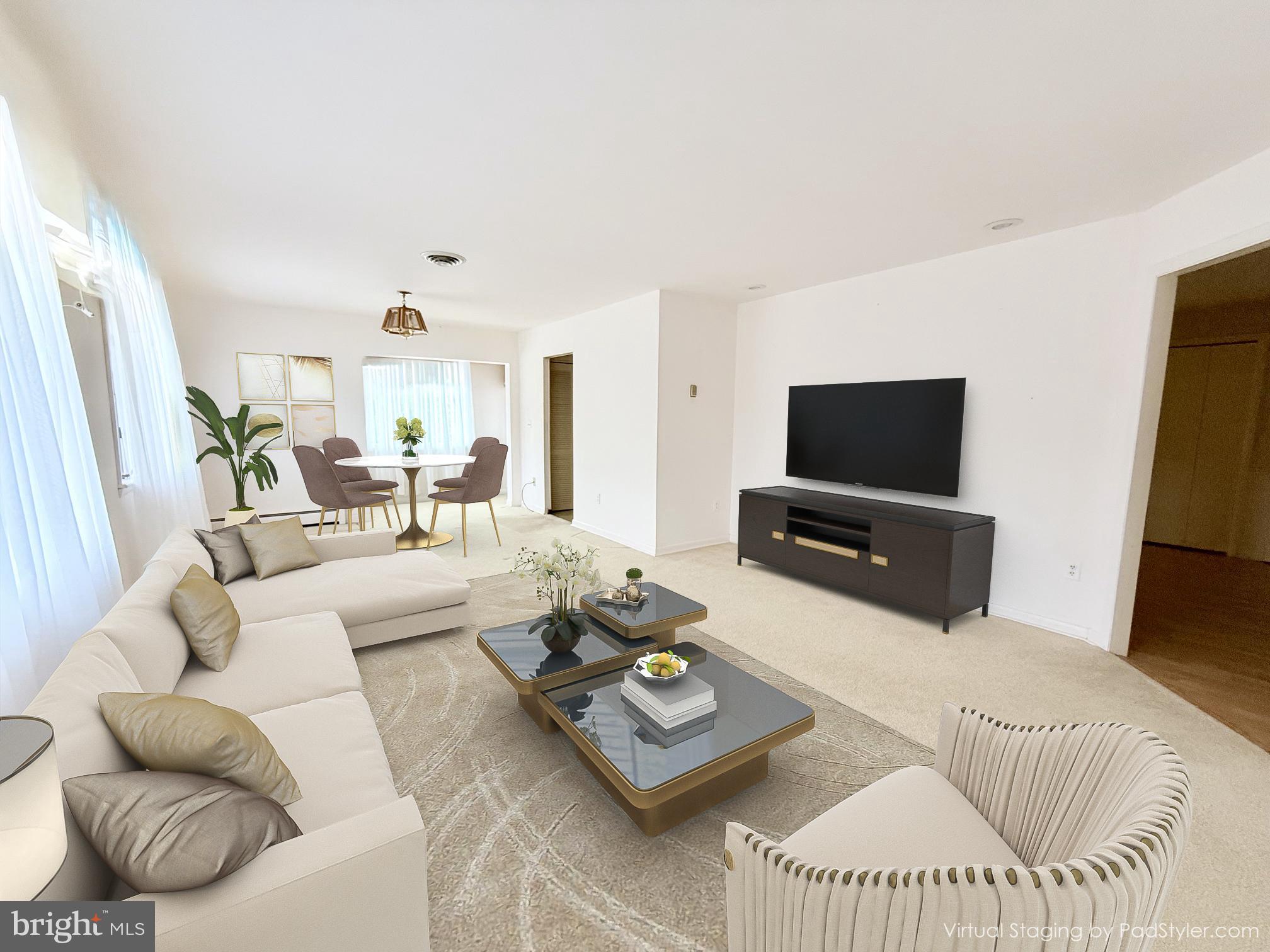 48724 Curleys Road Ridge, MD 20680 - Photo 11 of 47 a living room with furniture a flat screen tv and a window