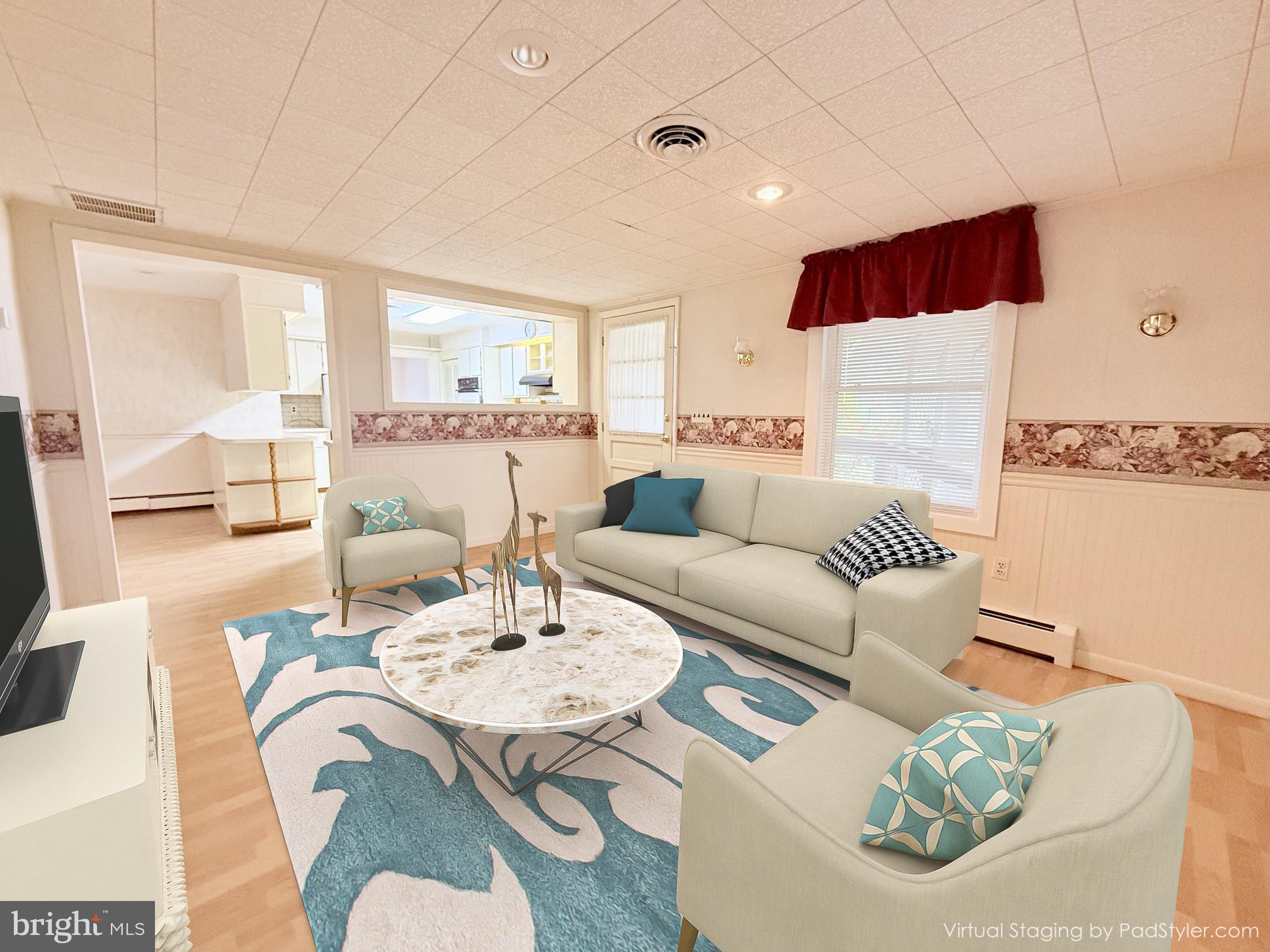 48724 Curleys Road Ridge, MD 20680 - Photo 12 of 47 a living room with furniture and a large window