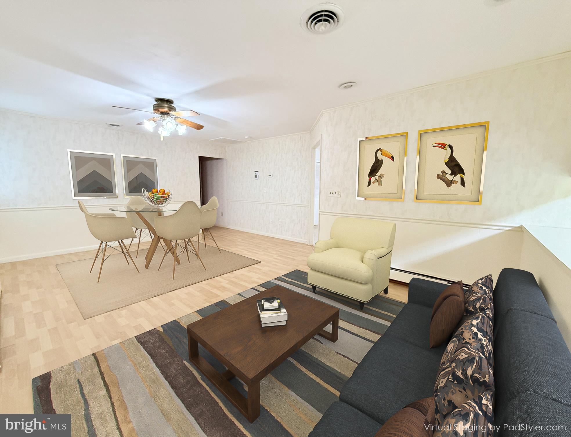 48724 Curleys Road Ridge, MD 20680 - Photo 13 of 47 a living room with furniture and a wooden floor