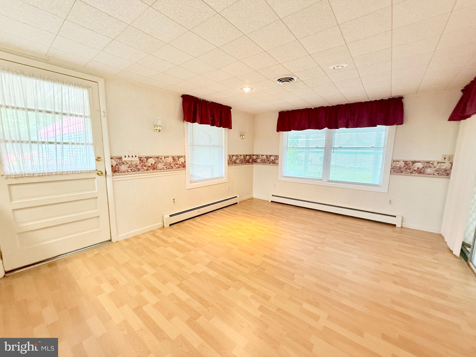 48724 Curleys Road Ridge, MD 20680 - Photo 23 of 47 a view of an empty room with a window