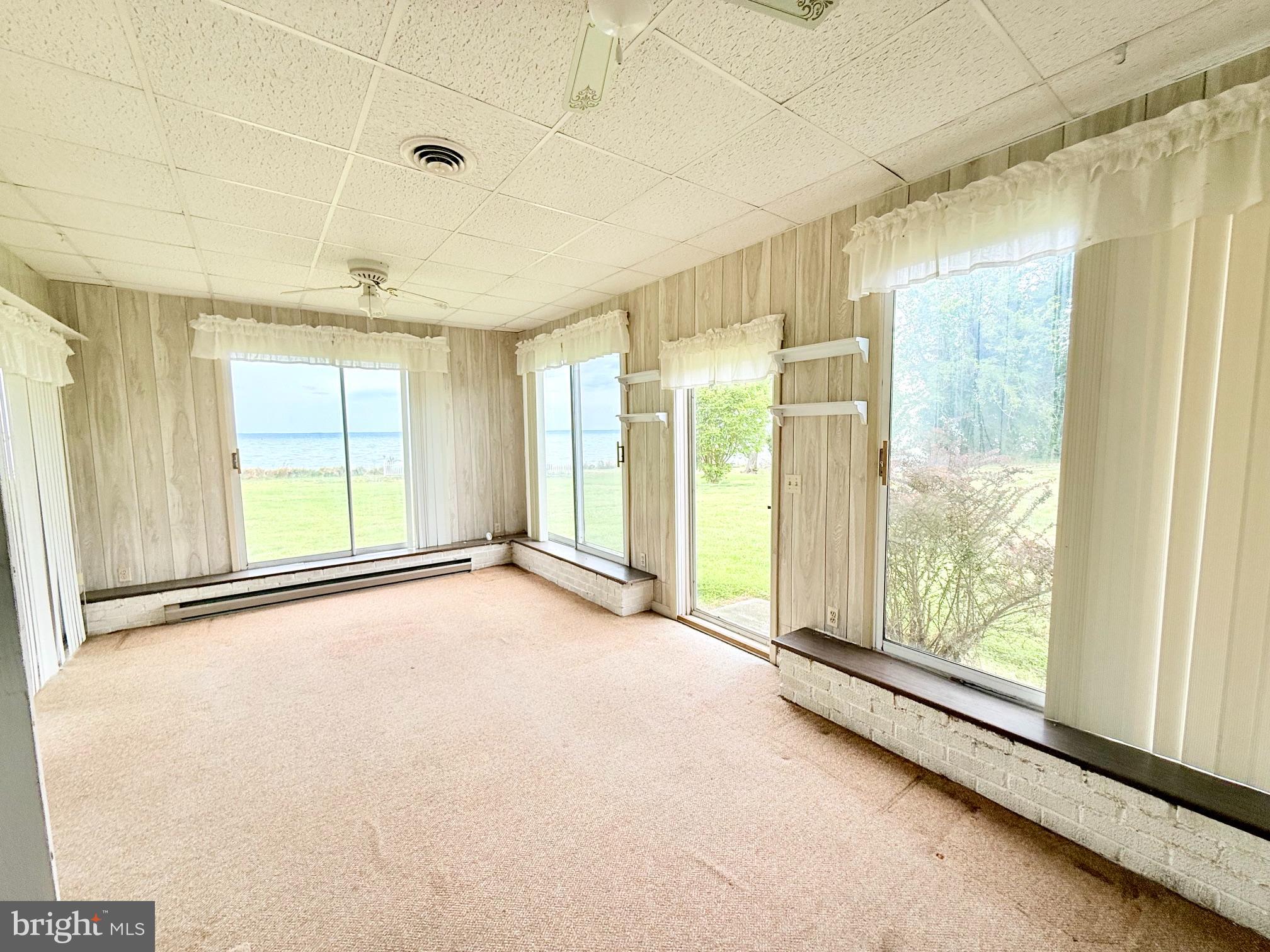 48724 Curleys Road Ridge, MD 20680 - Photo 28 of 47 a view of an empty room with a window