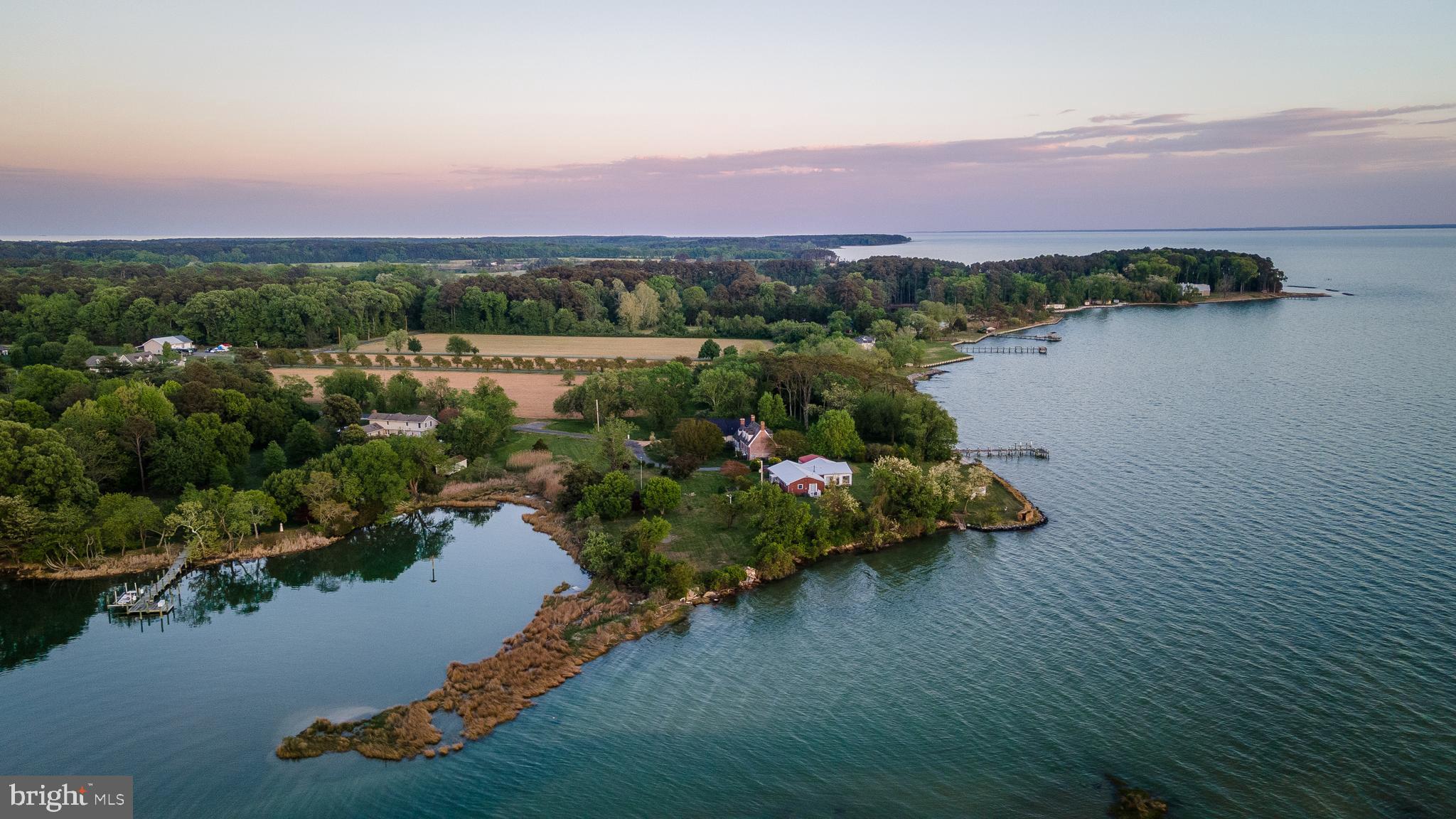 48724 Curleys Road Ridge, MD 20680 - Photo 7 of 47 an aerial view of a house with a lake view