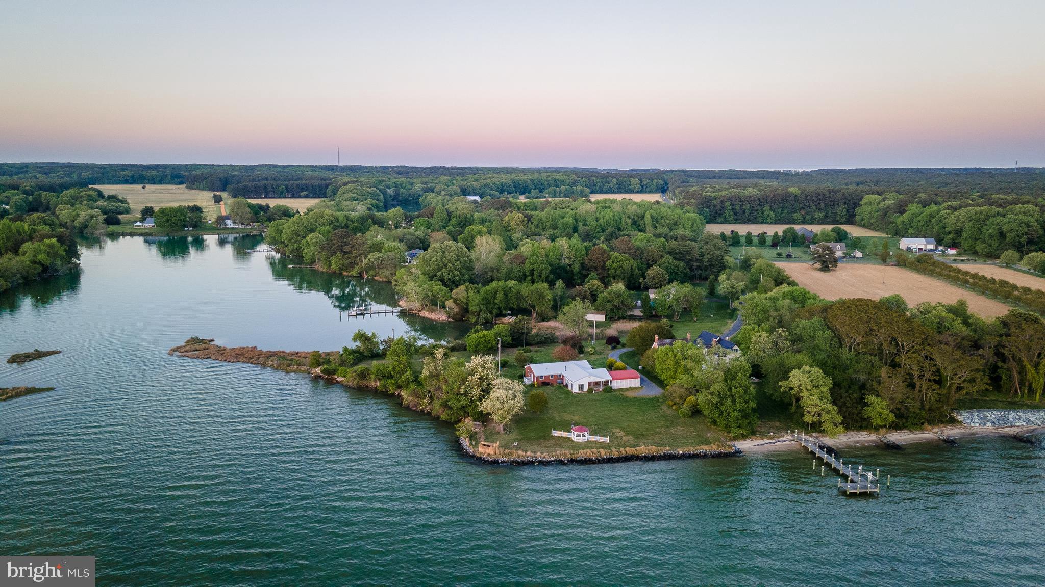48724 Curleys Road Ridge, MD 20680 - Photo 8 of 47 an aerial view of a house with a lake view