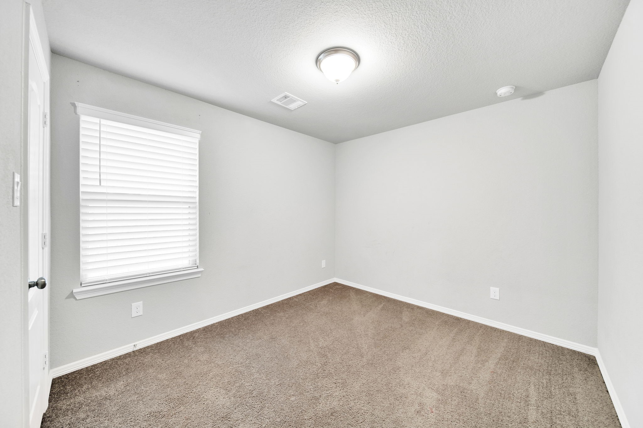 24722 Colony Meadow Trail Houston, TX 77336 - Photo 11 of 16 an empty room with a window
