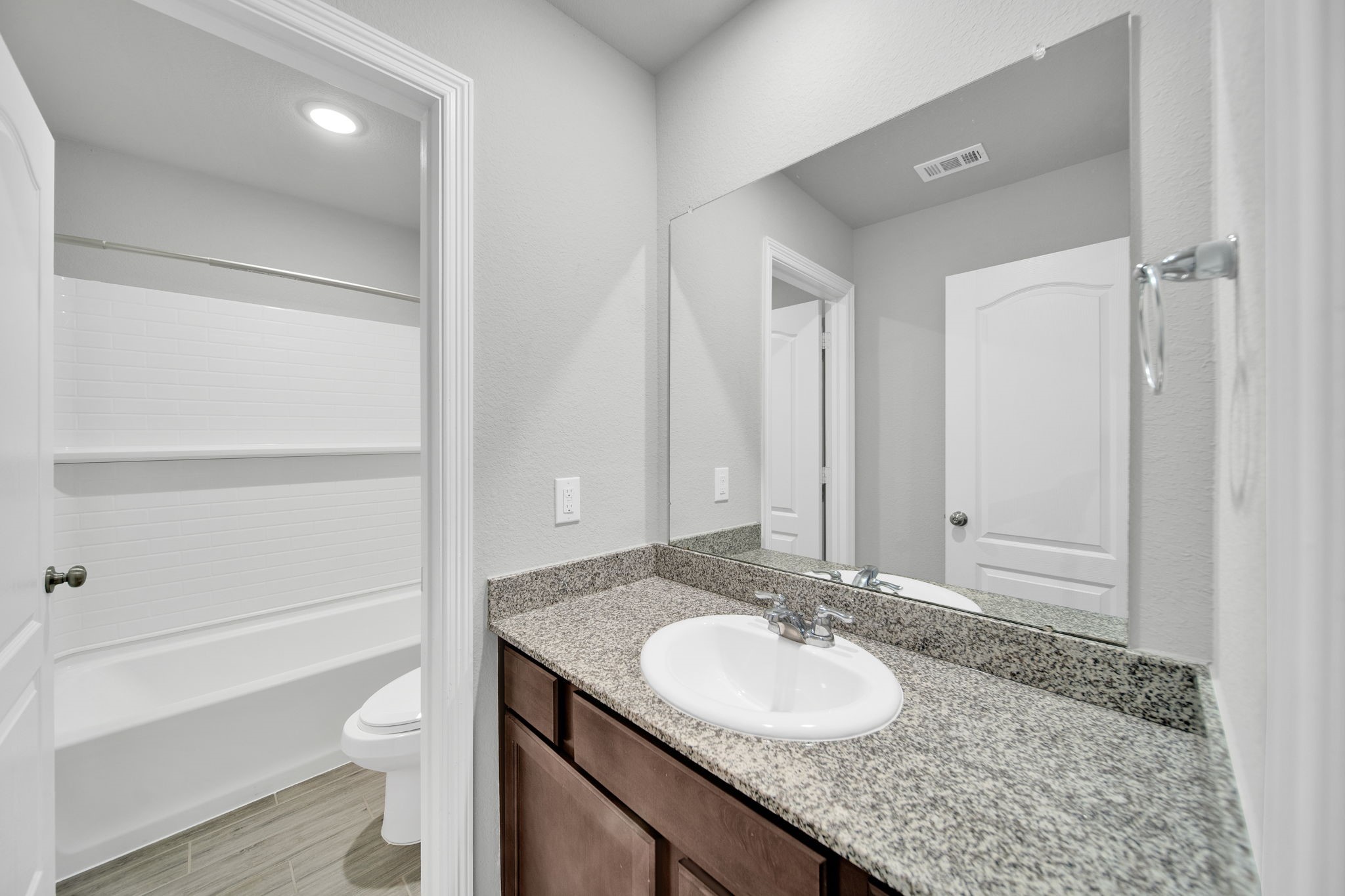 24722 Colony Meadow Trail Houston, TX 77336 - Photo 12 of 16 a bathroom with a granite countertop sink toilet and shower
