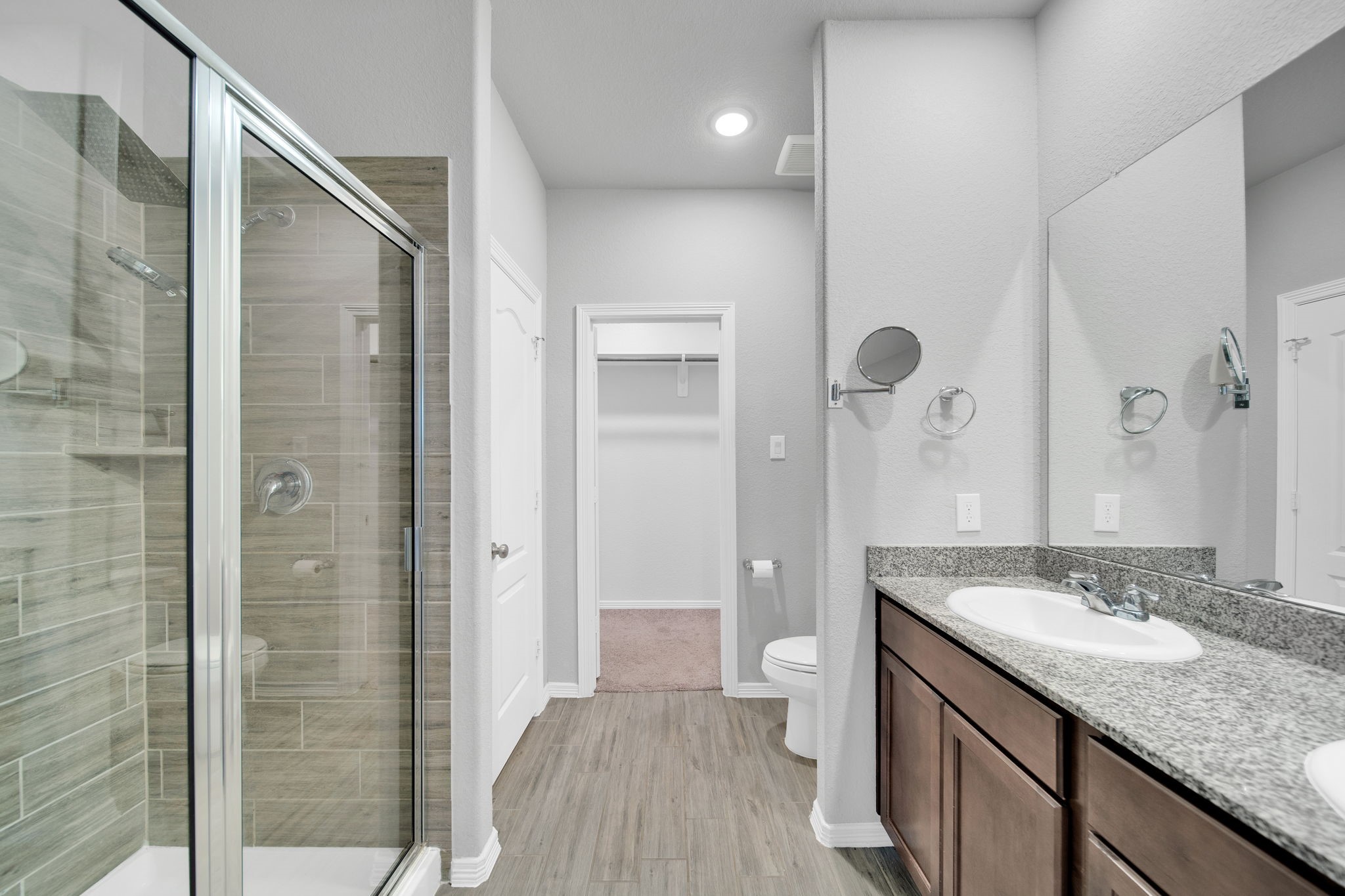 24722 Colony Meadow Trail Houston, TX 77336 - Photo 8 of 16 a bathroom with a granite countertop sink a toilet and shower