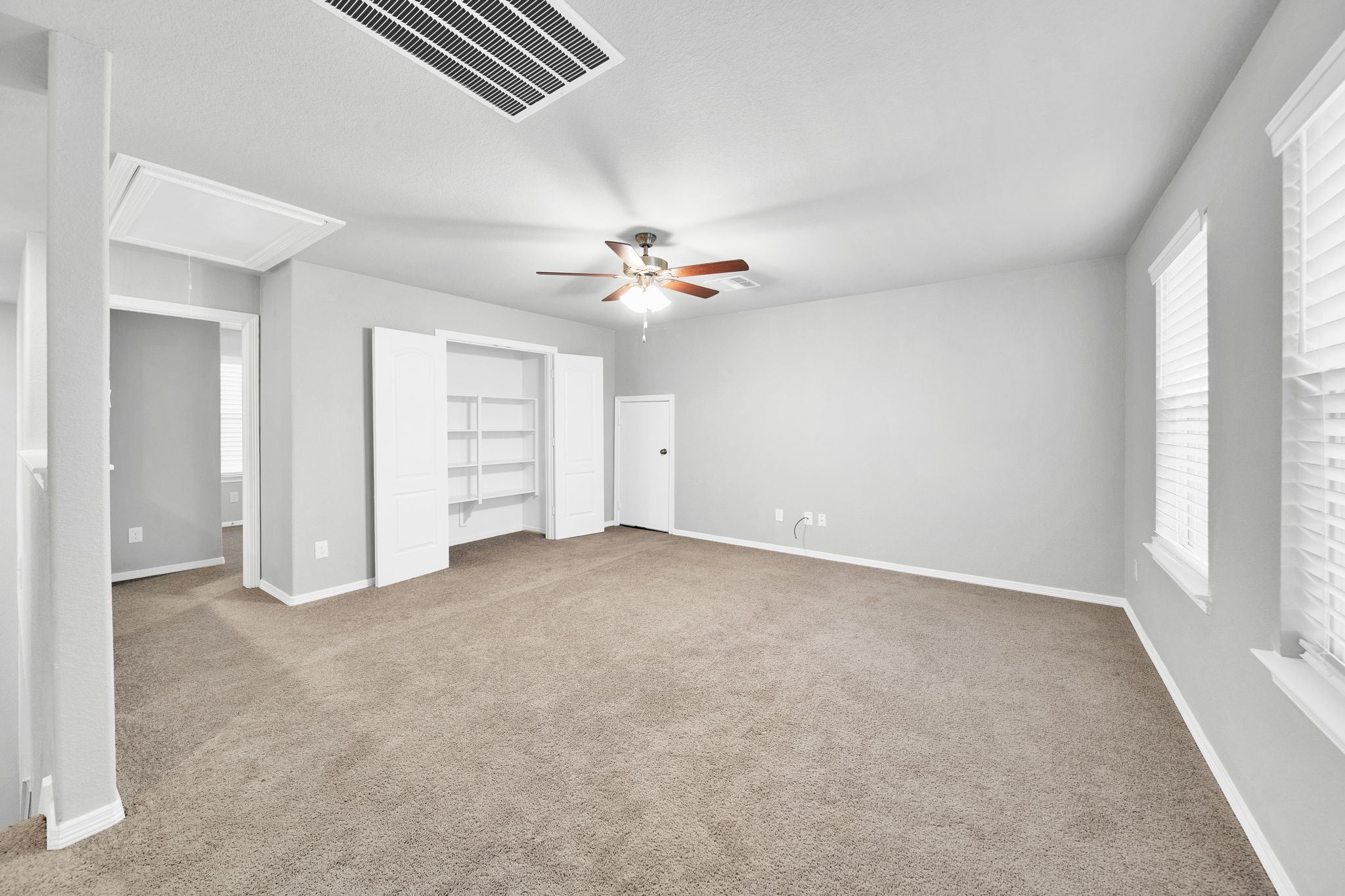 24722 Colony Meadow Trail Houston, TX 77336 - Photo 10 of 16 an empty room with closet and windows