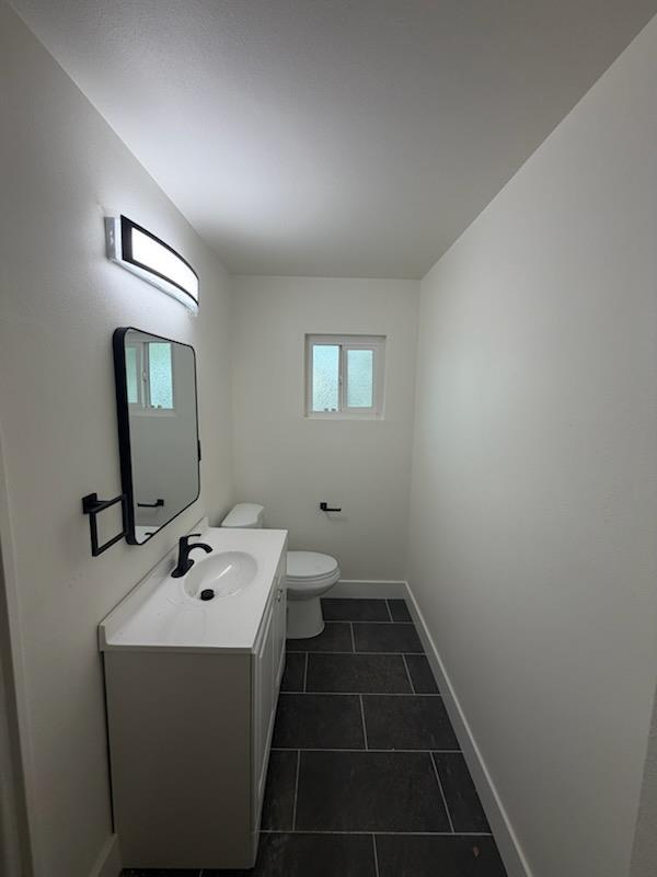 8625 La Vaca Way Hanford, CA 93230 - Photo 15 of 20 a bathroom with a sink toilet and mirror