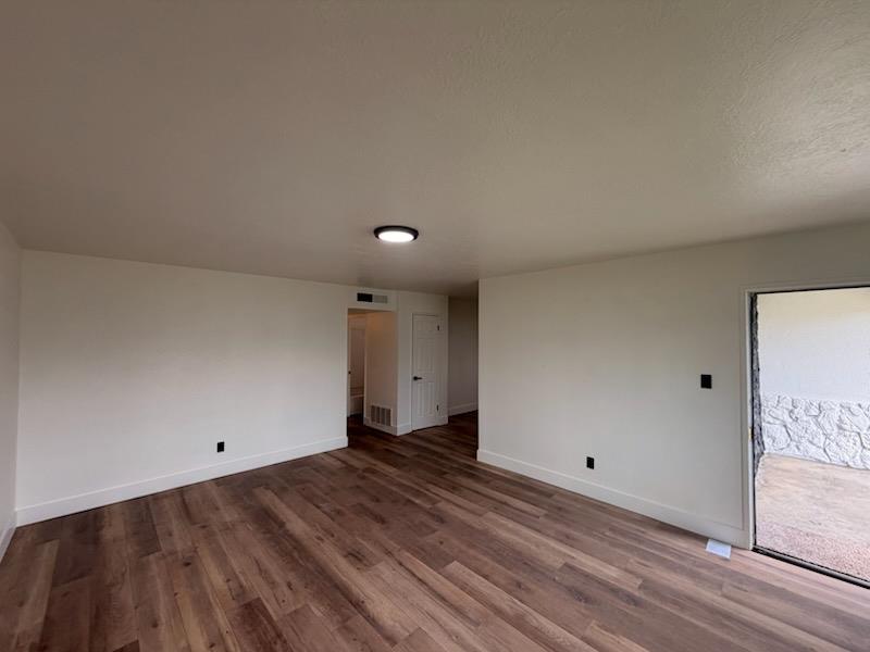8625 La Vaca Way Hanford, CA 93230 - Photo 3 of 20 a view of a room with wooden floor