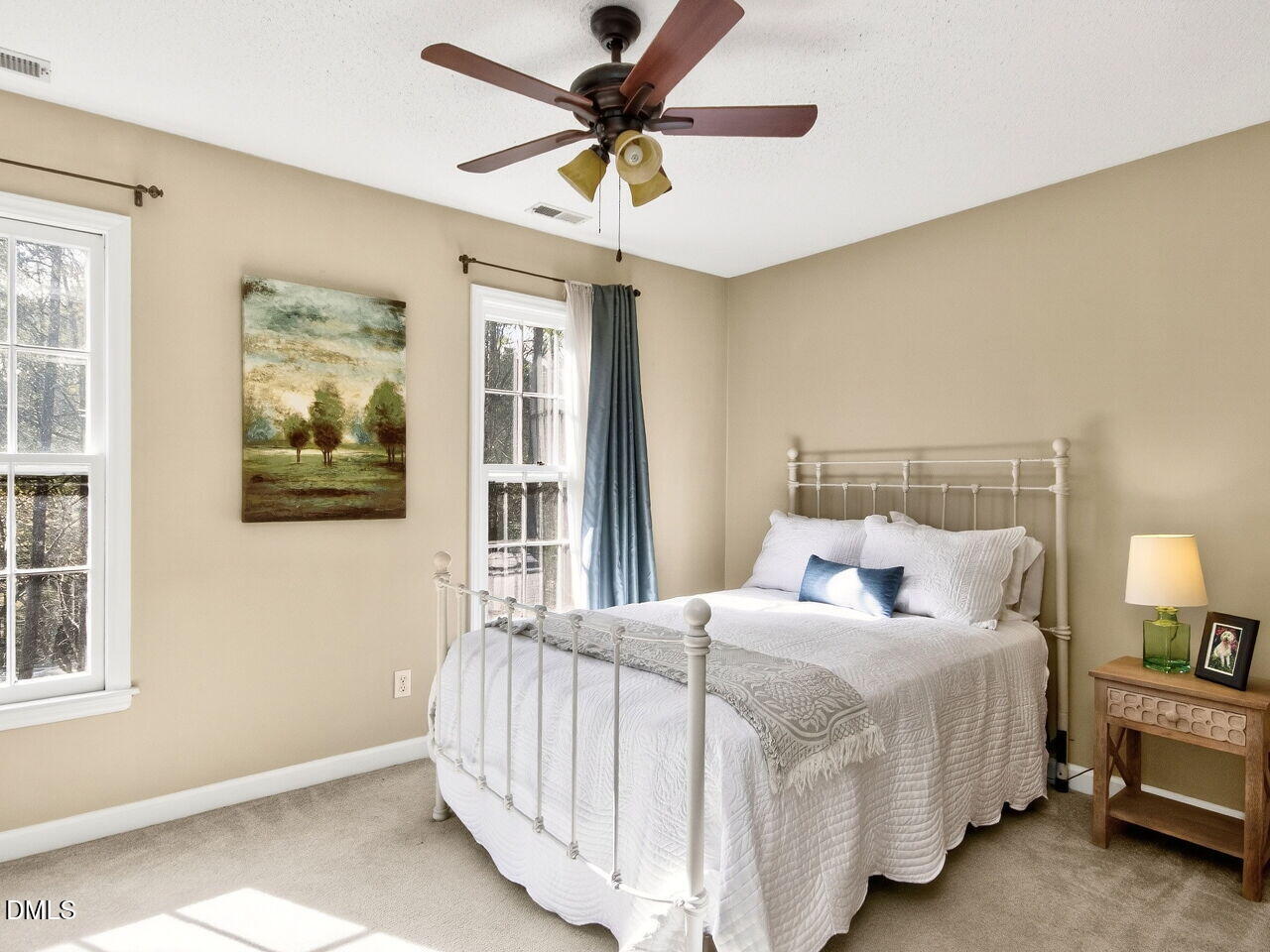 6703 Queen Annes Drive Raleigh, NC 27613 - Photo 11 of 20 a bedroom with a bed and a window
