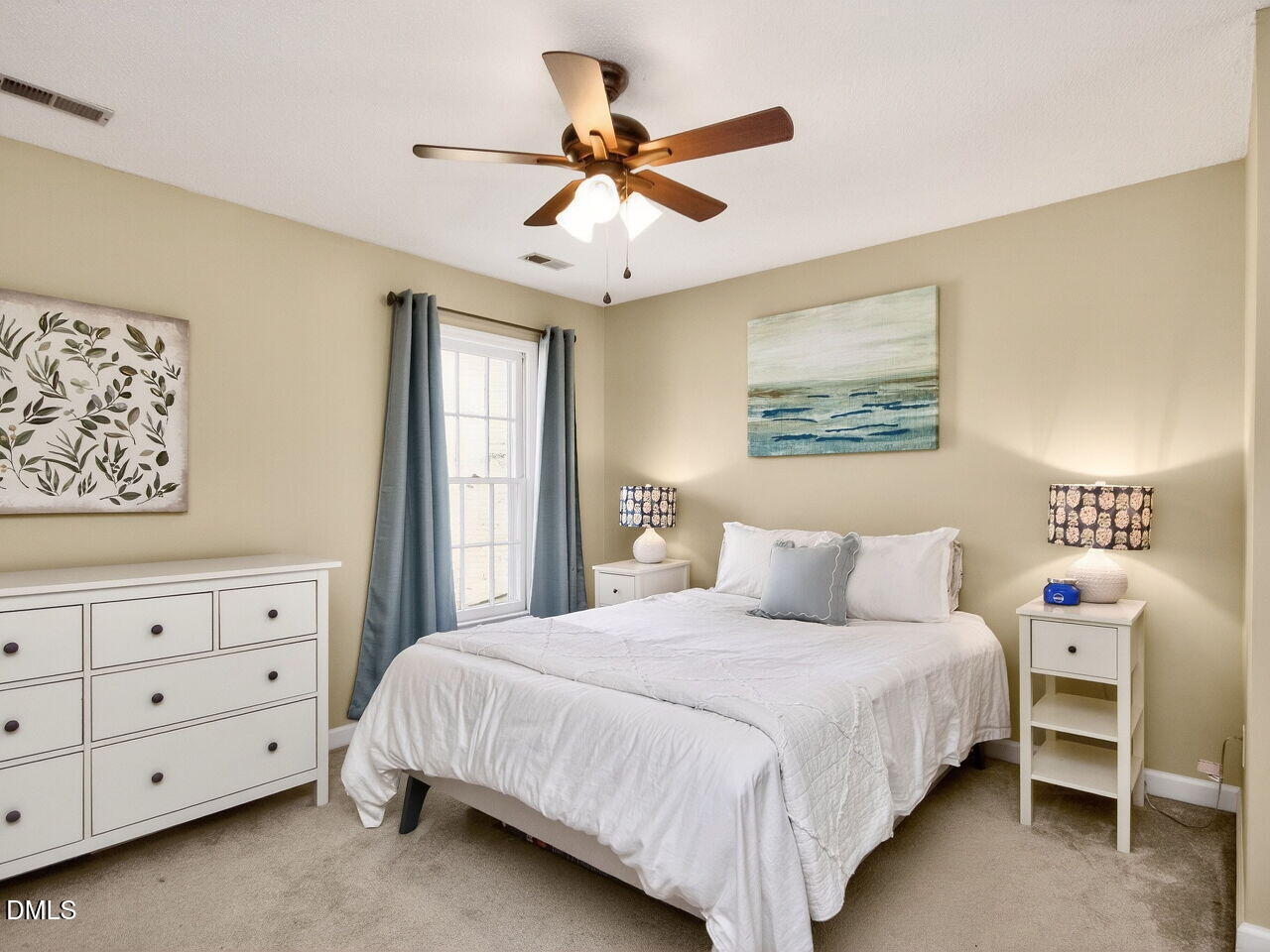 6703 Queen Annes Drive Raleigh, NC 27613 - Photo 13 of 20 a bedroom with a bed and window