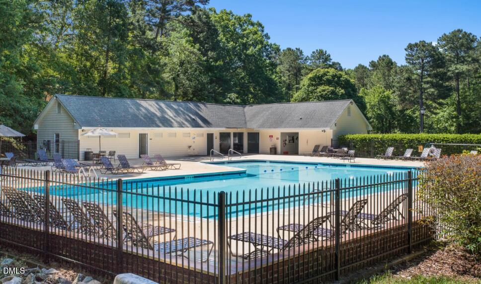 6703 Queen Annes Drive Raleigh, NC 27613 - Photo 18 of 20 a view of a house with backyard and sitting area