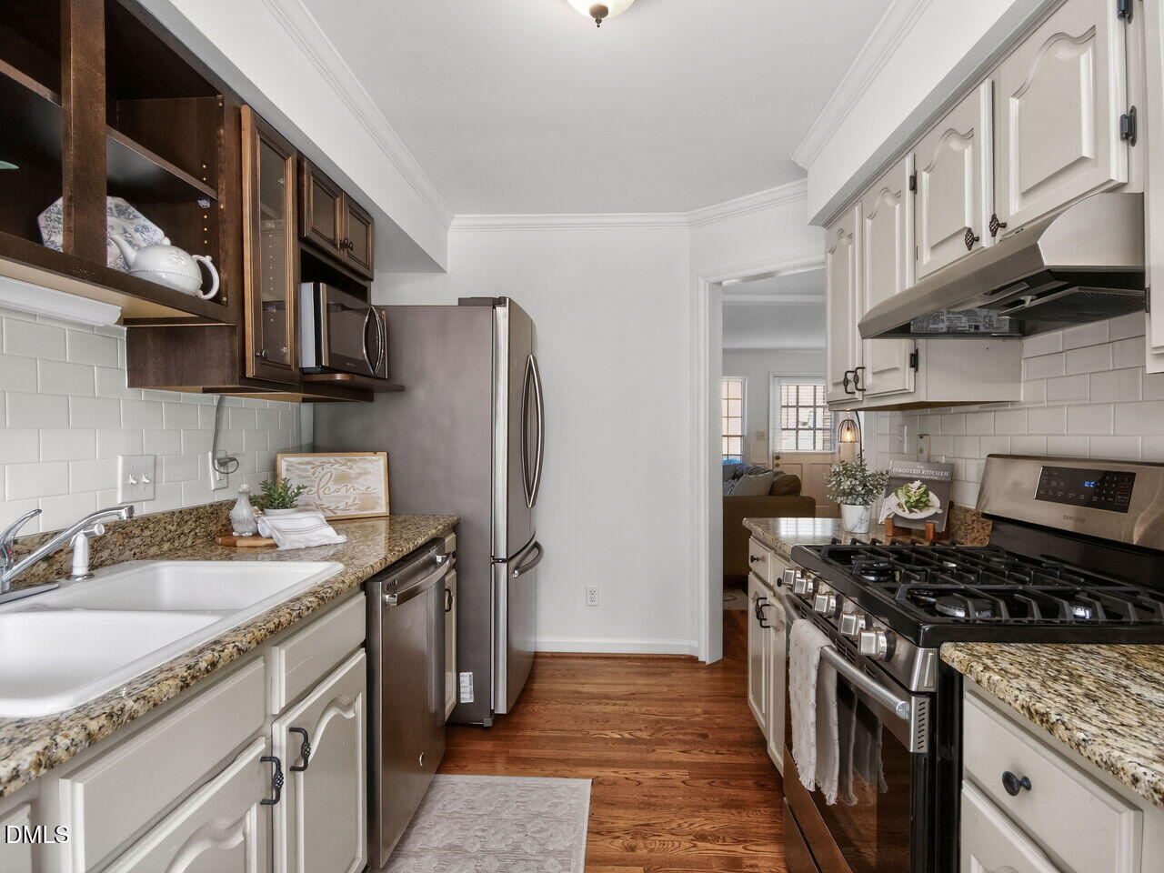 6703 Queen Annes Drive Raleigh, NC 27613 - Photo 6 of 20 a kitchen with stainless steel appliances granite countertop a sink stove and refrigerator
