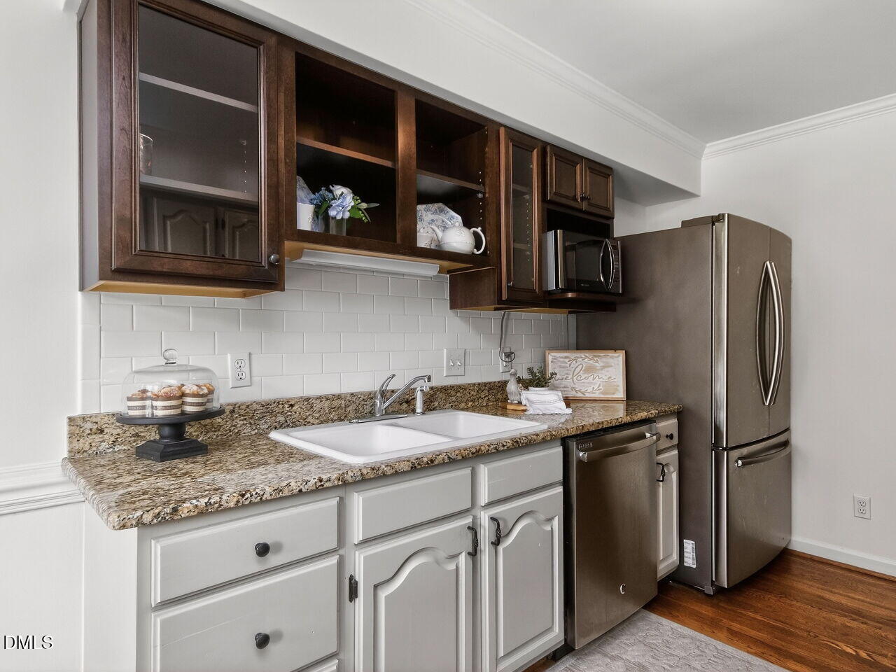 6703 Queen Annes Drive Raleigh, NC 27613 - Photo 7 of 20 a kitchen with stainless steel appliances granite countertop a sink stove and refrigerator