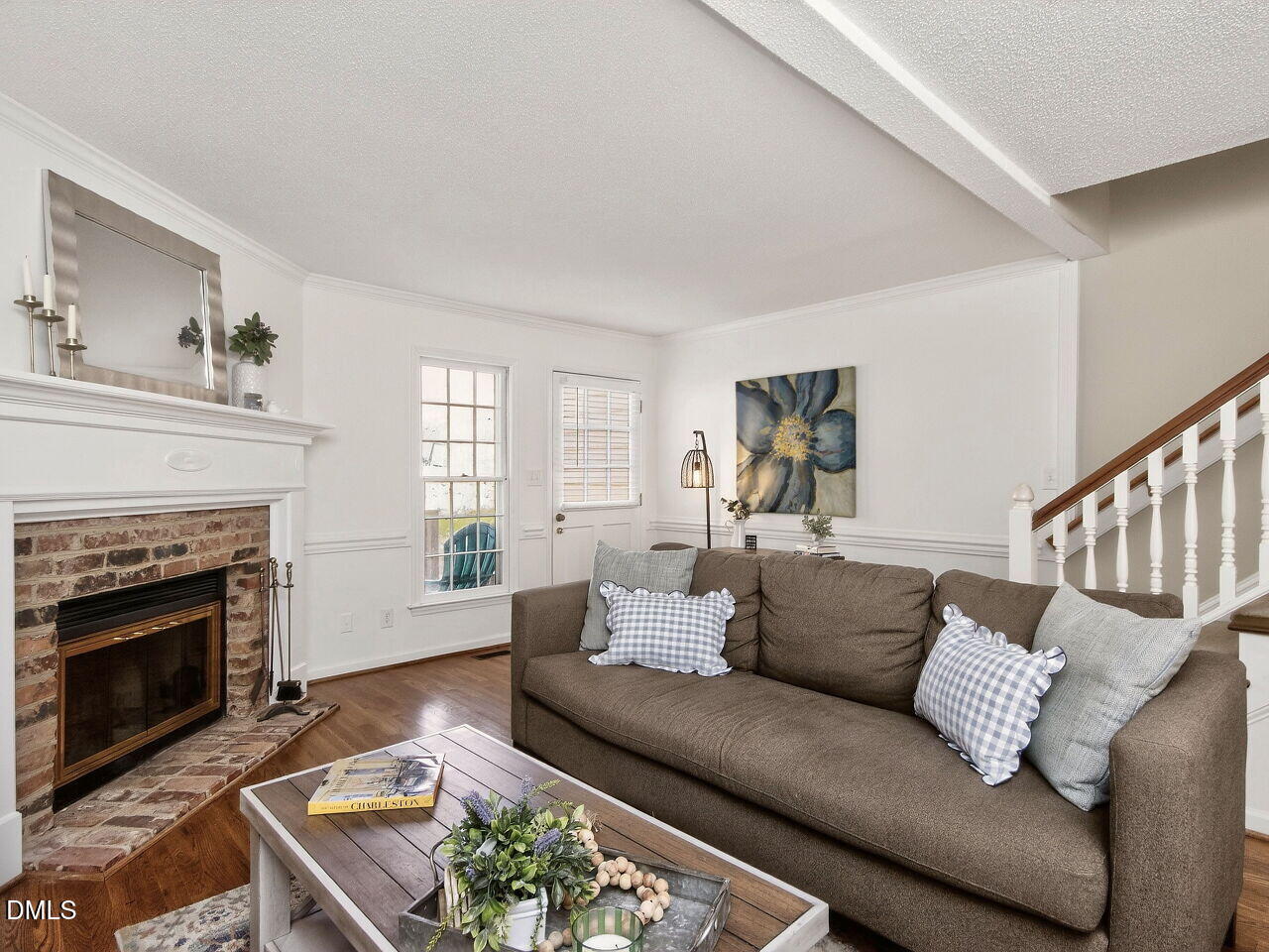 6703 Queen Annes Drive Raleigh, NC 27613 - Photo 10 of 20 a living room with furniture and a fireplace