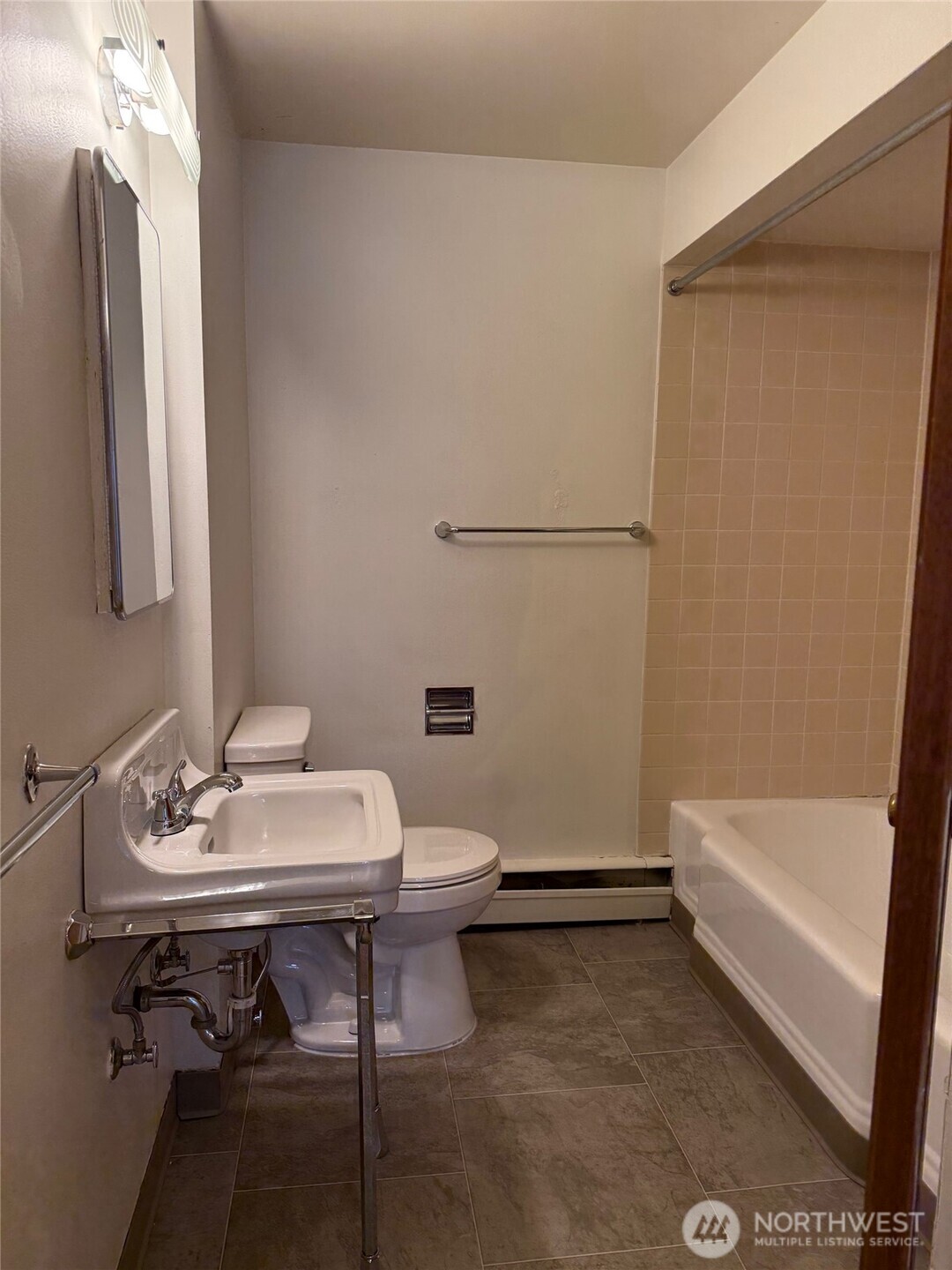 5120 Colby Avenue, Unit 1 Everett, WA 98203 - Photo 8 of 9 a bathroom with a sink toilet and shower