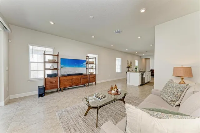 a living room with furniture and a table
