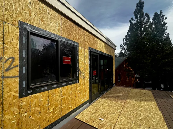 a window with a white building