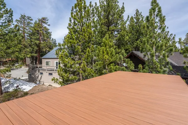 a view of a house with a tree